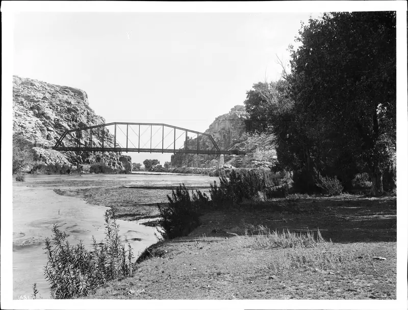 Historic photo of a steel railroad bridge over the Mojave River at the Narrows near Victorville, circa 1905