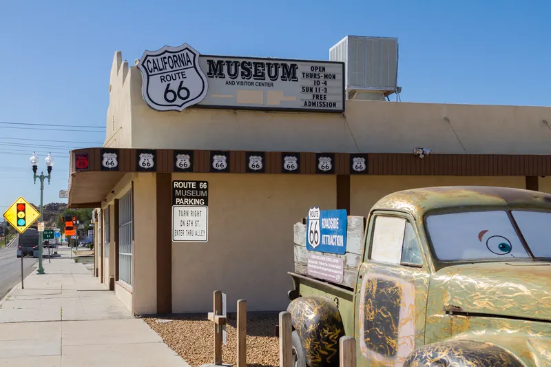 Front of the California Route 66 Museum on D Street in Victorville with a vintage truck outside