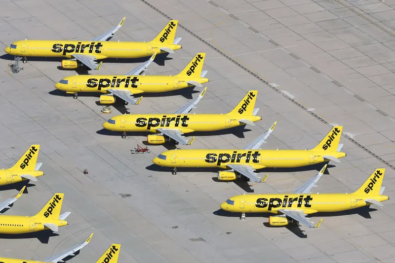 Yellow Spirit Airlines jets parked in a row at Southern California Logistics Airport in 2026